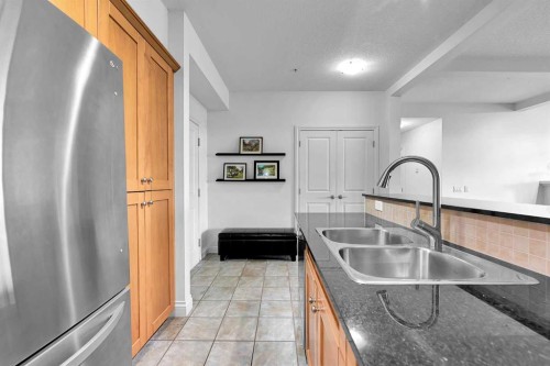 2105-10221 Tuscany Boulevard Nw, Calgary, AB - Indoor Photo Showing Kitchen With Double Sink