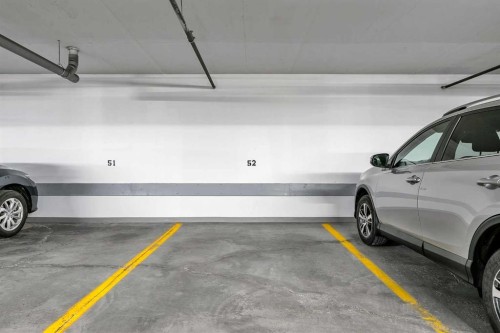 2105-10221 Tuscany Boulevard Nw, Calgary, AB - Indoor Photo Showing Garage