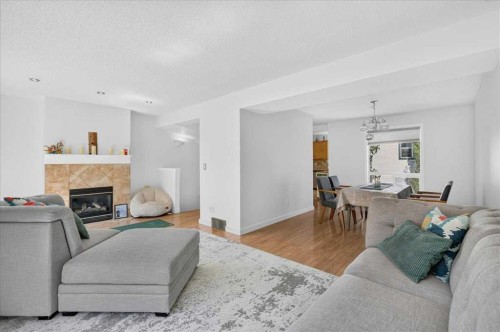 137 Bridlewood Lane Sw, Calgary, AB - Indoor Photo Showing Living Room With Fireplace