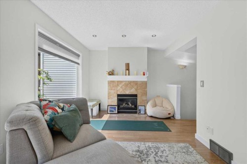 137 Bridlewood Lane Sw, Calgary, AB - Indoor Photo Showing Living Room With Fireplace