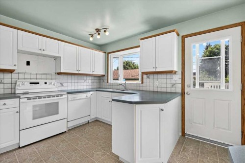 7727 Bowcliffe Crescent Nw, Calgary, AB - Indoor Photo Showing Kitchen With Double Sink