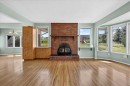 7727 Bowcliffe Crescent Nw, Calgary, AB  - Indoor Photo Showing Living Room With Fireplace 