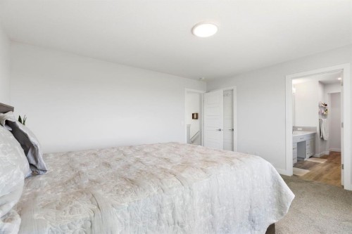 183 Brander Avenue, Langdon, AB - Indoor Photo Showing Bedroom