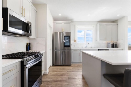 183 Brander Avenue, Langdon, AB - Indoor Photo Showing Kitchen With Upgraded Kitchen