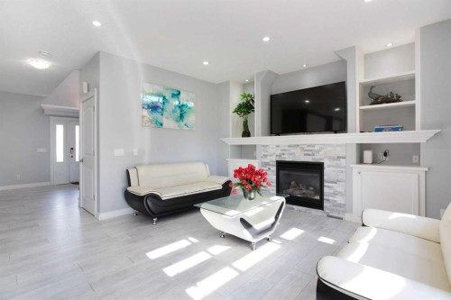 1925 Luxstone Park Sw, Airdrie, AB - Indoor Photo Showing Living Room With Fireplace