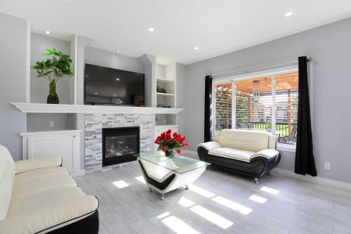 1925 Luxstone Park Sw, Airdrie, AB - Indoor Photo Showing Living Room With Fireplace