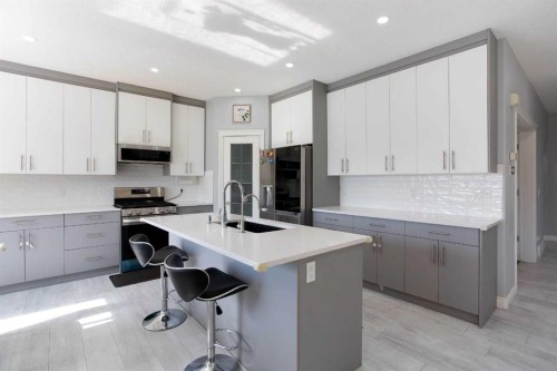 1925 Luxstone Park Sw, Airdrie, AB - Indoor Photo Showing Kitchen With Upgraded Kitchen