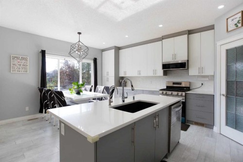 1925 Luxstone Park Sw, Airdrie, AB - Indoor Photo Showing Kitchen With Upgraded Kitchen