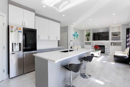 1925 Luxstone Park Sw, Airdrie, AB - Indoor Photo Showing Kitchen With Upgraded Kitchen