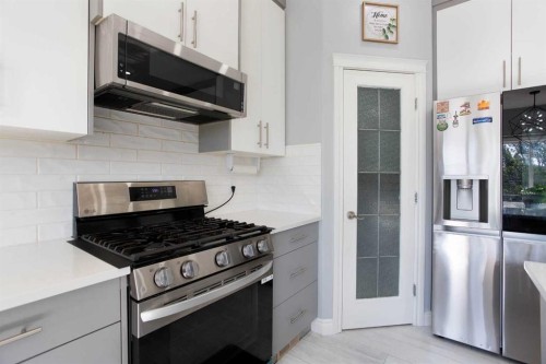 1925 Luxstone Park Sw, Airdrie, AB - Indoor Photo Showing Kitchen With Upgraded Kitchen