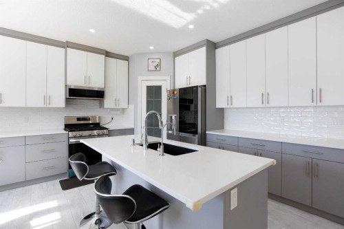 1925 Luxstone Park Sw, Airdrie, AB - Indoor Photo Showing Kitchen With Upgraded Kitchen