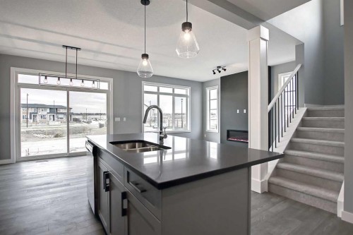 51 Agate Road, Cochrane, AB - Indoor Photo Showing Kitchen With Double Sink With Upgraded Kitchen