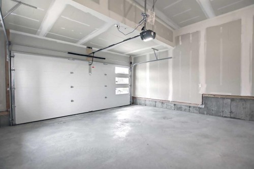 51 Agate Road, Cochrane, AB - Indoor Photo Showing Garage