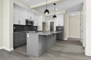 51 Agate Road, Cochrane, AB  - Indoor Photo Showing Kitchen With Upgraded Kitchen 