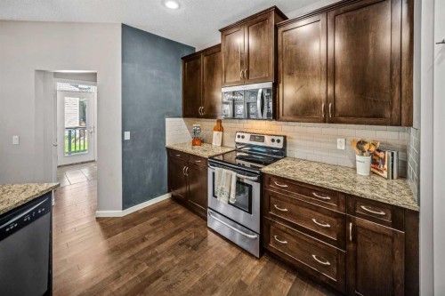 53 Heritage Drive, Cochrane, AB - Indoor Photo Showing Kitchen