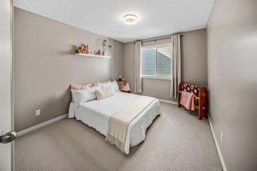 53 Heritage Drive, Cochrane, AB - Indoor Photo Showing Bedroom