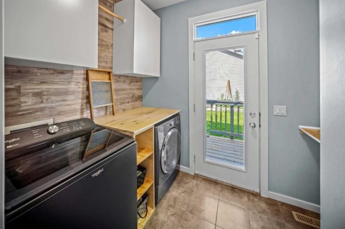 53 Heritage Drive, Cochrane, AB - Indoor Photo Showing Laundry Room