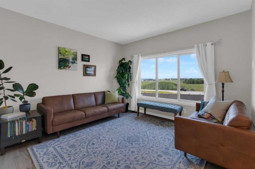311 Sunrise View, Cochrane, AB - Indoor Photo Showing Living Room