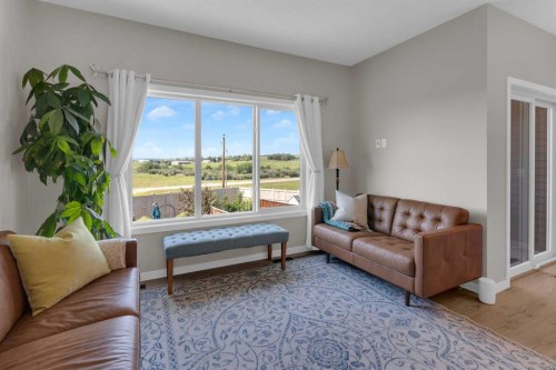 311 Sunrise View, Cochrane, AB - Indoor Photo Showing Living Room