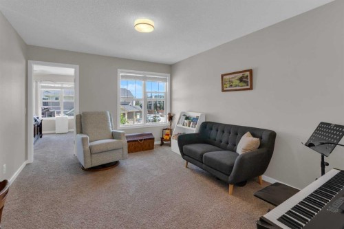 311 Sunrise View, Cochrane, AB - Indoor Photo Showing Living Room