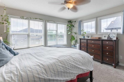 311 Sunrise View, Cochrane, AB - Indoor Photo Showing Bedroom