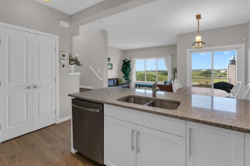 311 Sunrise View, Cochrane, AB - Indoor Photo Showing Kitchen With Double Sink