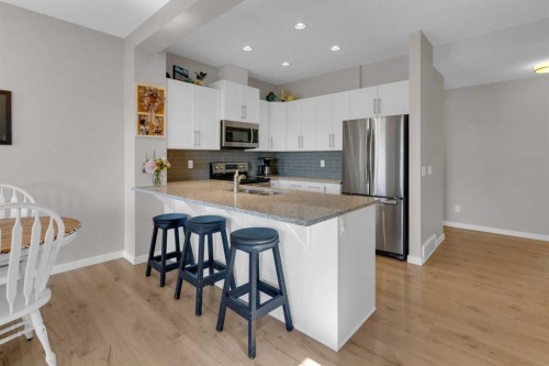 311 Sunrise View, Cochrane, AB - Indoor Photo Showing Kitchen With Stainless Steel Kitchen With Double Sink