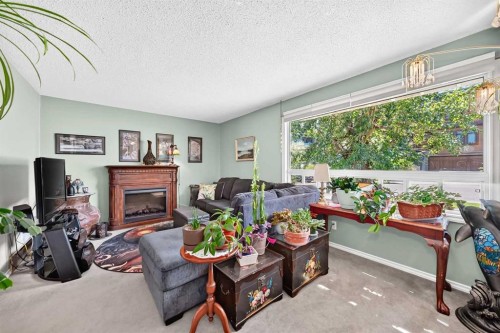 1926 28 Avenue Sw, Calgary, AB - Indoor Photo Showing Living Room With Fireplace