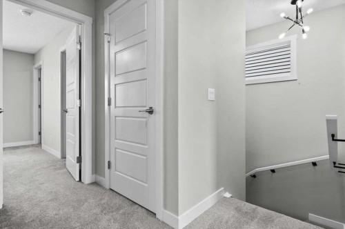 55 Agate Road, Cochrane, AB - Indoor Photo Showing Other Room
