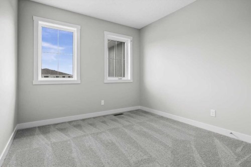 55 Agate Road, Cochrane, AB - Indoor Photo Showing Other Room