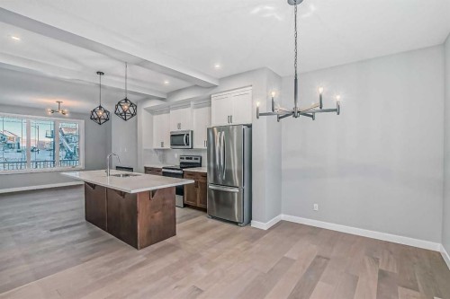 55 Agate Road, Cochrane, AB - Indoor Photo Showing Kitchen With Upgraded Kitchen