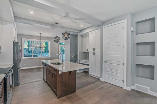 55 Agate Road, Cochrane, AB - Indoor Photo Showing Kitchen With Double Sink