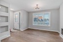 55 Agate Road, Cochrane, AB  - Indoor Photo Showing Other Room With Fireplace 