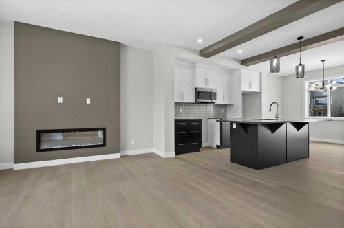55 Agate Road, Cochrane, AB - Indoor Photo Showing Kitchen With Upgraded Kitchen