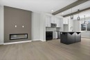 55 Agate Road, Cochrane, AB  - Indoor Photo Showing Kitchen With Upgraded Kitchen 