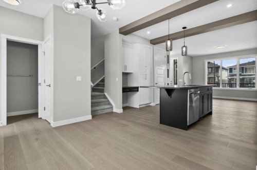 55 Agate Road, Cochrane, AB - Indoor Photo Showing Kitchen With Upgraded Kitchen