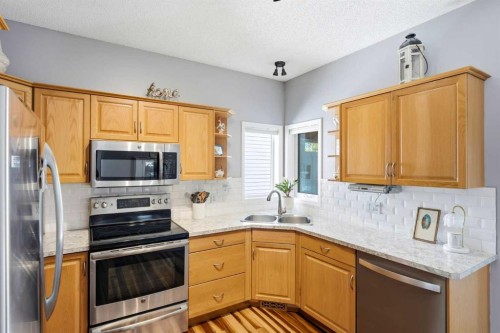 39 West Terrace Crescent, Cochrane, AB - Indoor Photo Showing Kitchen With Double Sink