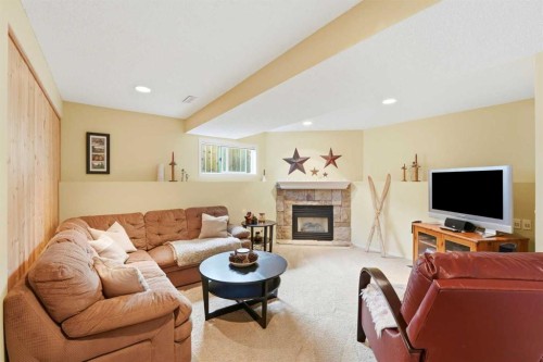 39 West Terrace Crescent, Cochrane, AB - Indoor Photo Showing Living Room With Fireplace