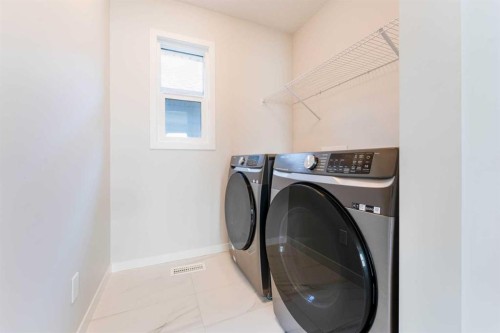 16 West Grove Link Sw, Calgary, AB - Indoor Photo Showing Laundry Room