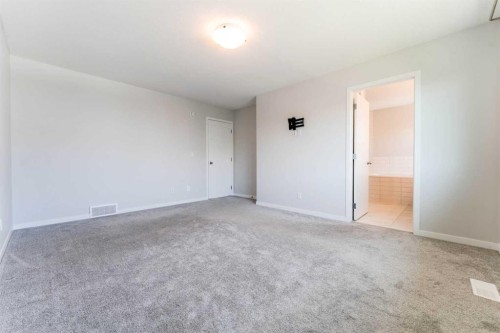 16 West Grove Link Sw, Calgary, AB - Indoor Photo Showing Other Room
