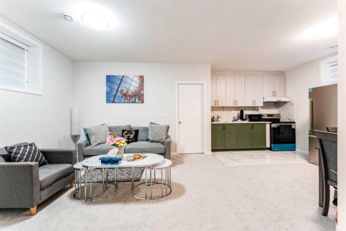 16 West Grove Link Sw, Calgary, AB - Indoor Photo Showing Living Room