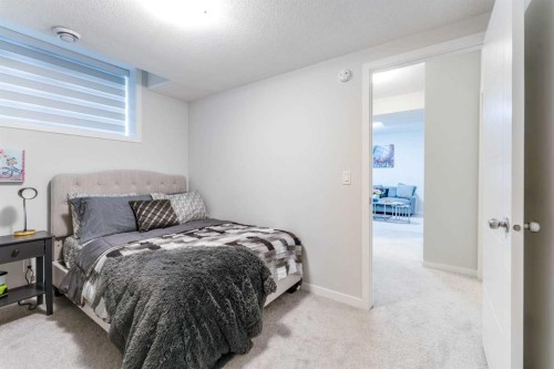16 West Grove Link Sw, Calgary, AB - Indoor Photo Showing Bedroom