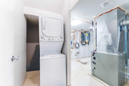 16 West Grove Link Sw, Calgary, AB - Indoor Photo Showing Laundry Room