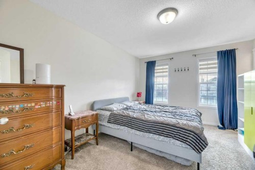 175 Prestwick Villas Se, Calgary, AB - Indoor Photo Showing Bedroom