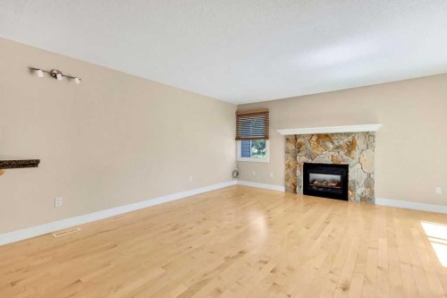 252-66 Glamis Green Sw, Calgary, AB - Indoor Photo Showing Living Room With Fireplace