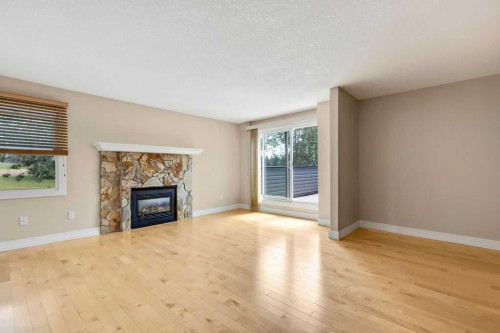 252-66 Glamis Green Sw, Calgary, AB - Indoor Photo Showing Living Room With Fireplace