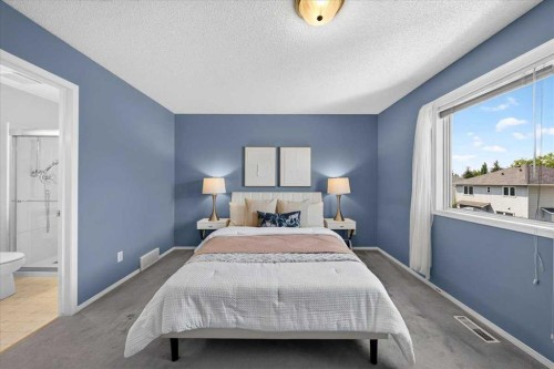 232 Douglas Glen Close Se, Calgary, AB - Indoor Photo Showing Bedroom