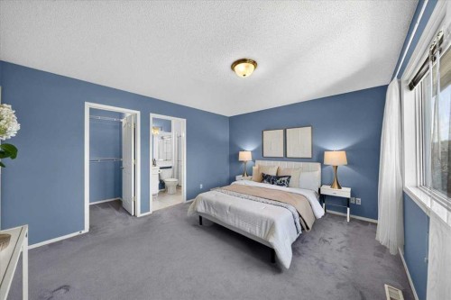 232 Douglas Glen Close Se, Calgary, AB - Indoor Photo Showing Bedroom