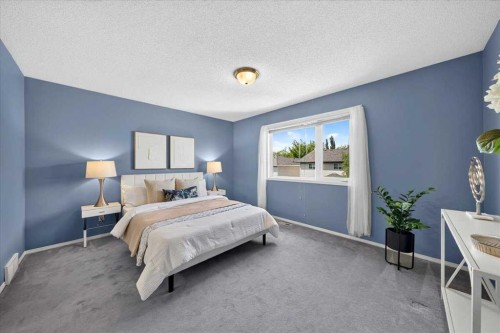 232 Douglas Glen Close Se, Calgary, AB - Indoor Photo Showing Bedroom