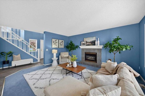 232 Douglas Glen Close Se, Calgary, AB - Indoor Photo Showing Living Room With Fireplace